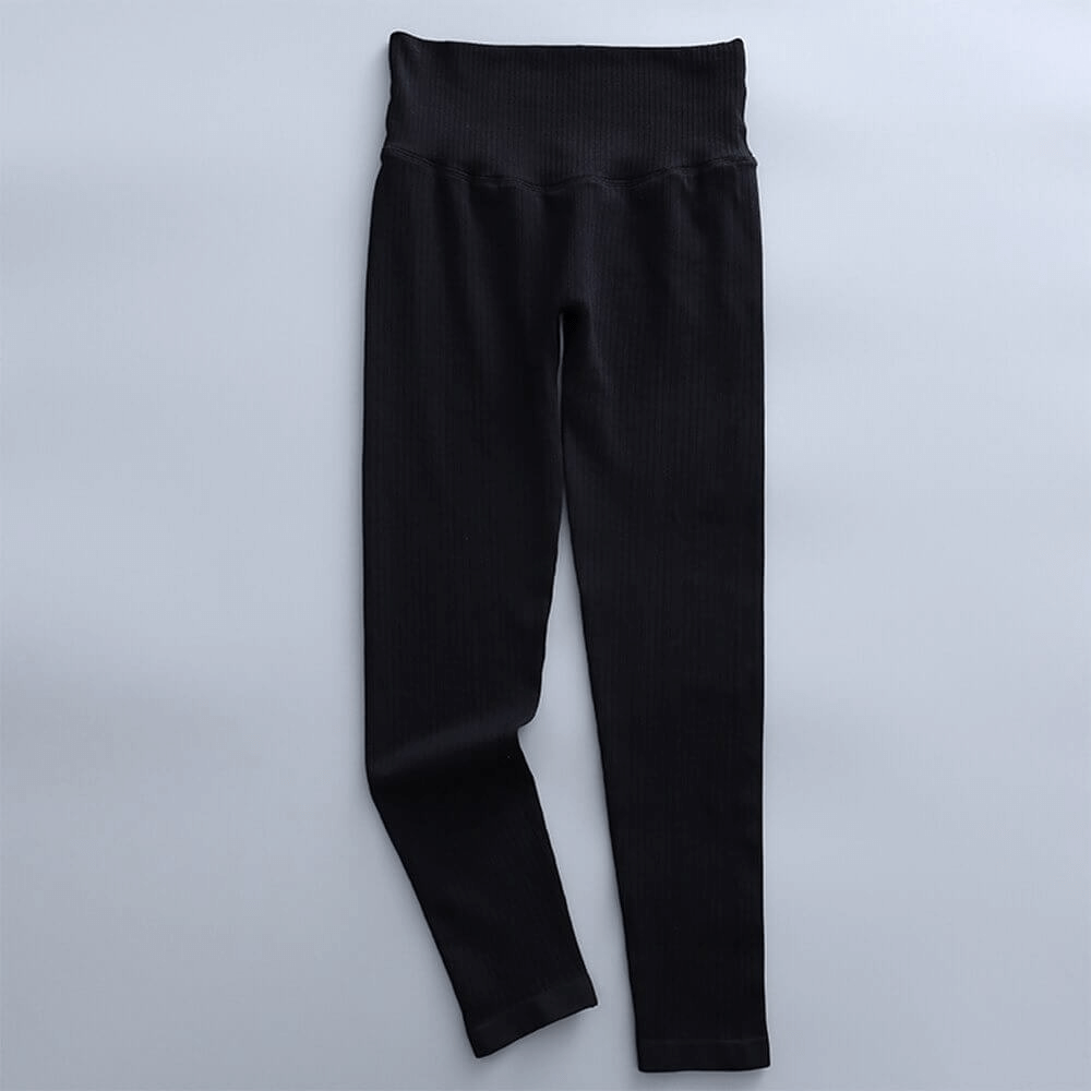 Black seamless ribbed leggings with high waist for women, perfect for yoga or exercise. Nylon-spandex blend for comfort and support.